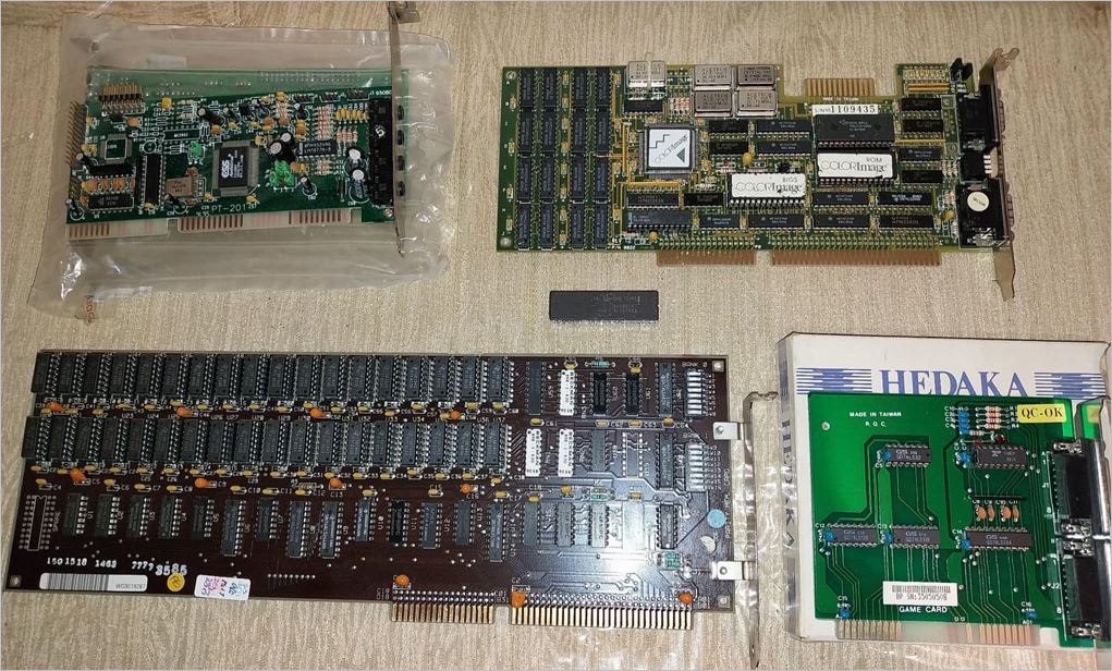 IBM 5170 Upgrades (top to bottom).. Sound Card, VGA/EGA Video Card, 80287 Coprocessor, Ram Expansion,  Gamecard